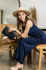 Braided ring handle wristlet clutch