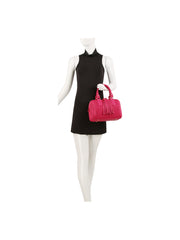 Braided satchel with tassel