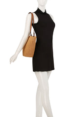 Straw basket bag with vegan leather handle
